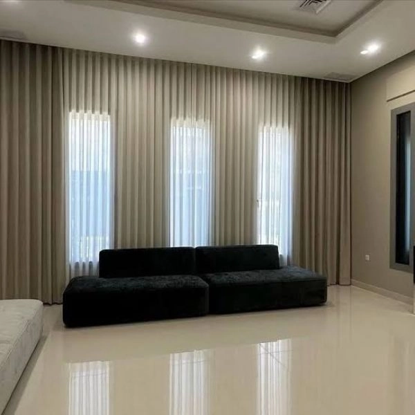 Sleek beige curtains for office windows Dubai