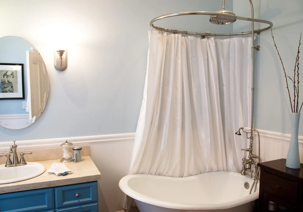 White shower curtain oval tub enclosure