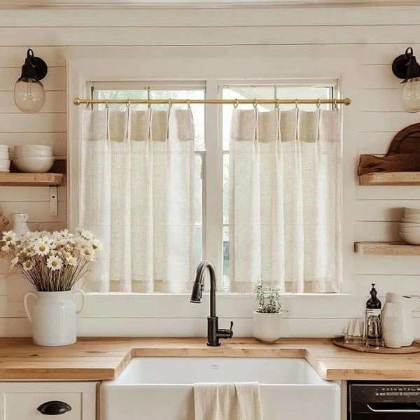 Short linen cafe curtains above sink