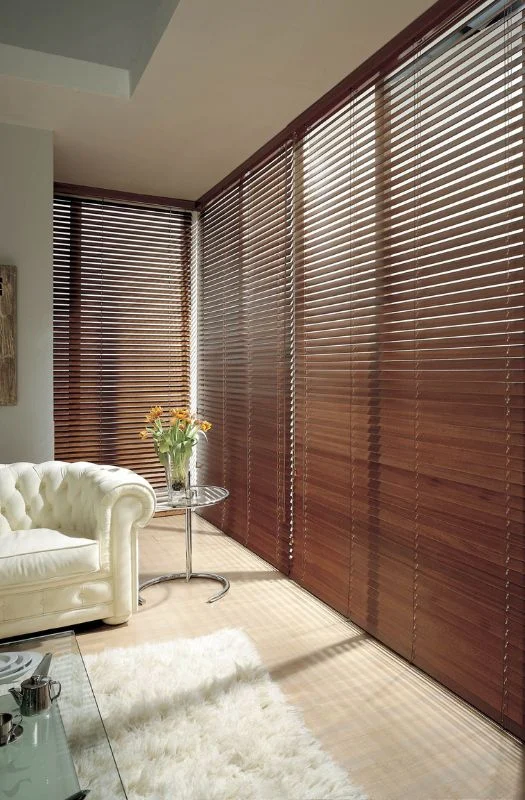 Dark mahogany wooden blinds white armchair