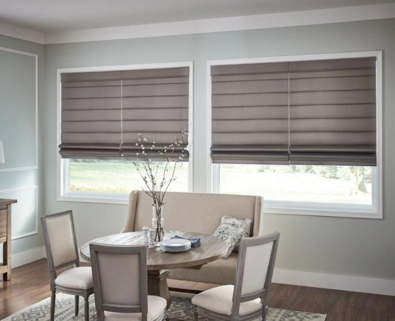 Dark grey roman blinds dining room