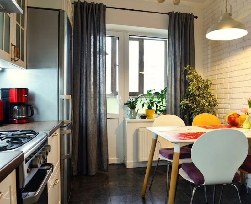 Dark grey curtains in compact kitchen