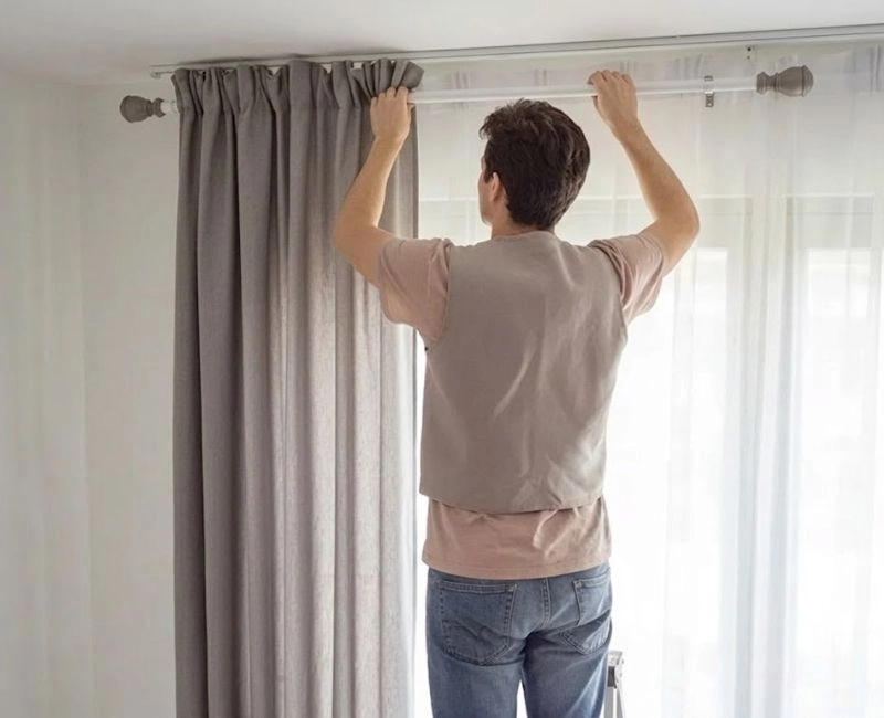 Hanging heavy drapes during curtain installation
