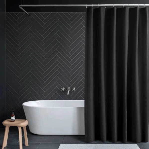 Solid black shower curtain dark bathroom