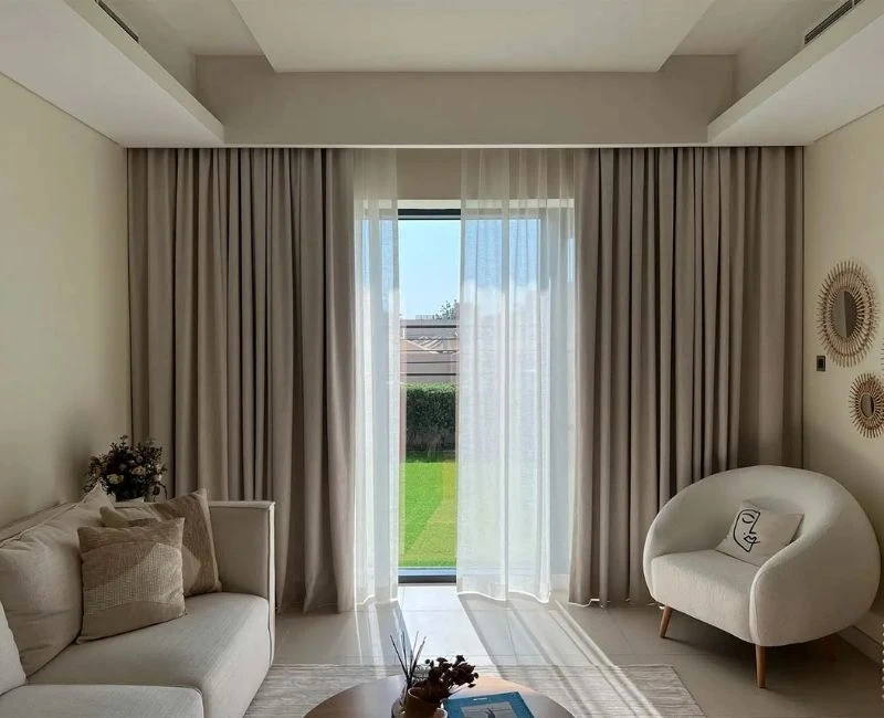 Neutral tone living room curtains garden view