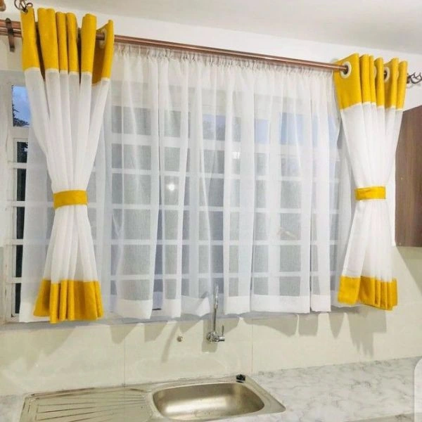 White sheer curtains with yellow borders