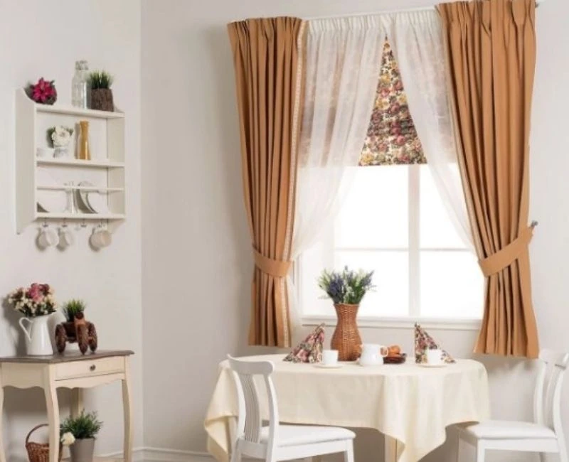 Light brown tied curtains with sheer