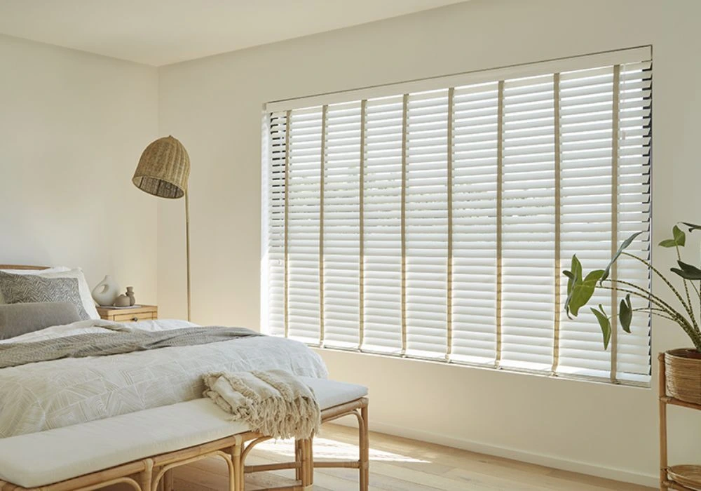 White Venetian blinds bedroom large window