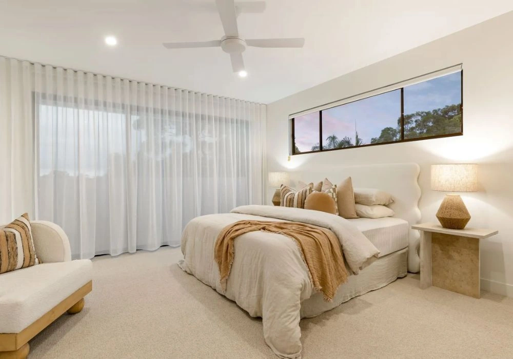 Soft white sheer curtains cozy luxury bedroom