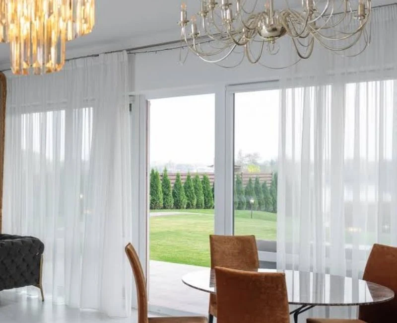 Minimalist white sheer curtains garden patio view