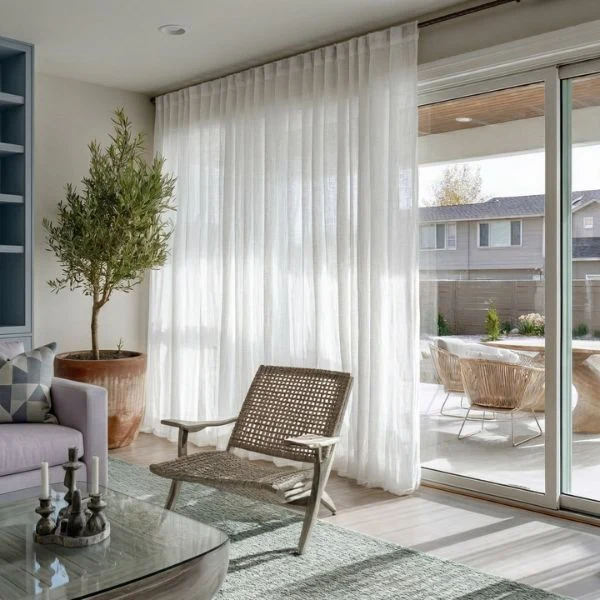 Elegant white sheer curtains sliding glass door