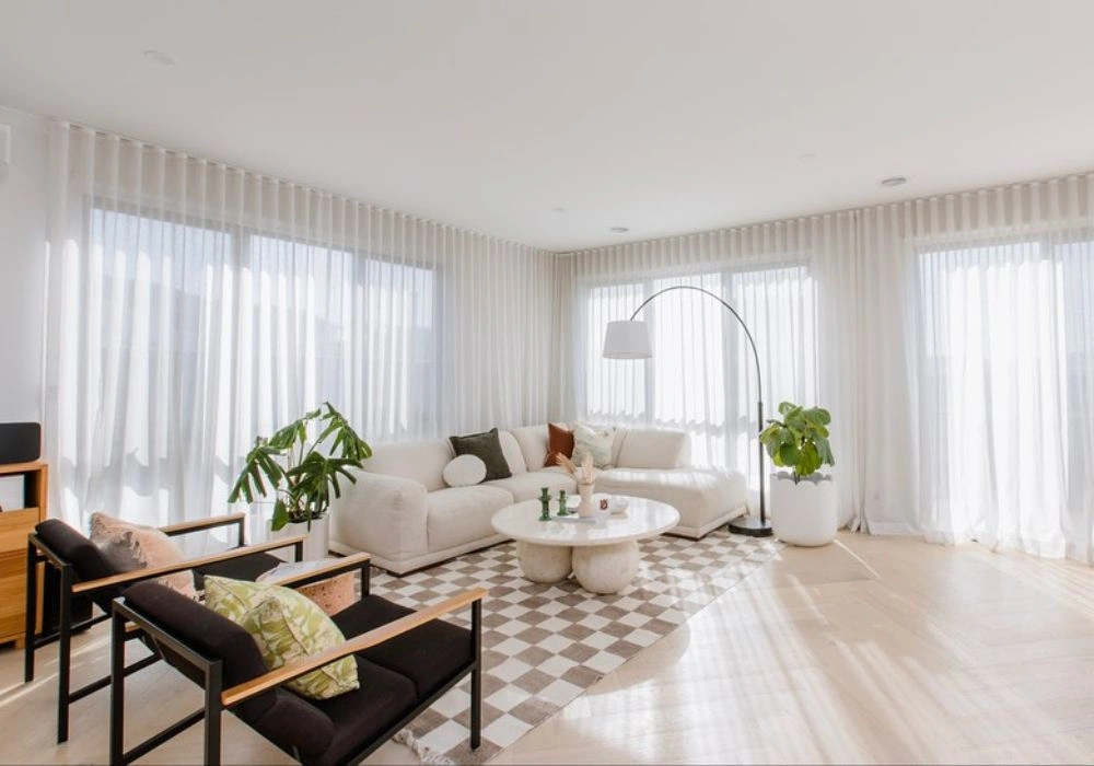 Minimalist white sheer curtains spacious modern lounge