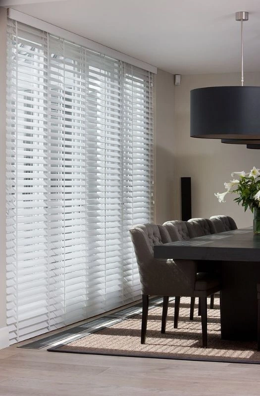 White wooden blinds dining room setup
