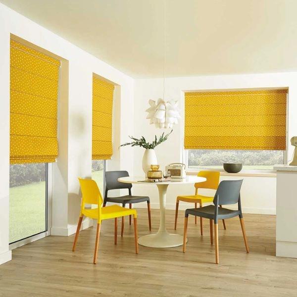 Bright yellow polka dot roman blinds