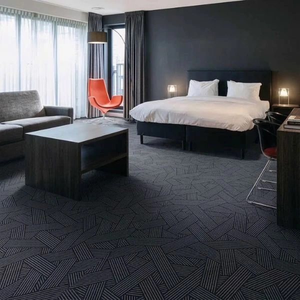 Dark grey geometric carpet in modern bedroom