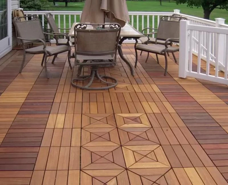 Patterned wood deck tiles with patio furniture