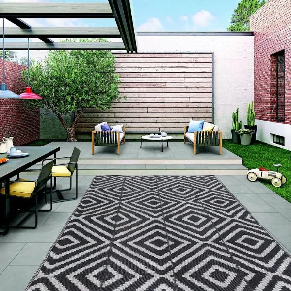 Geometric outdoor rug on garden patio deck