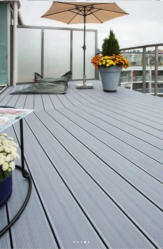 Modern apartment balcony with grey WPC deck