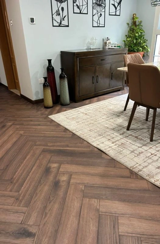 Dark walnut herringbone floor in dining space