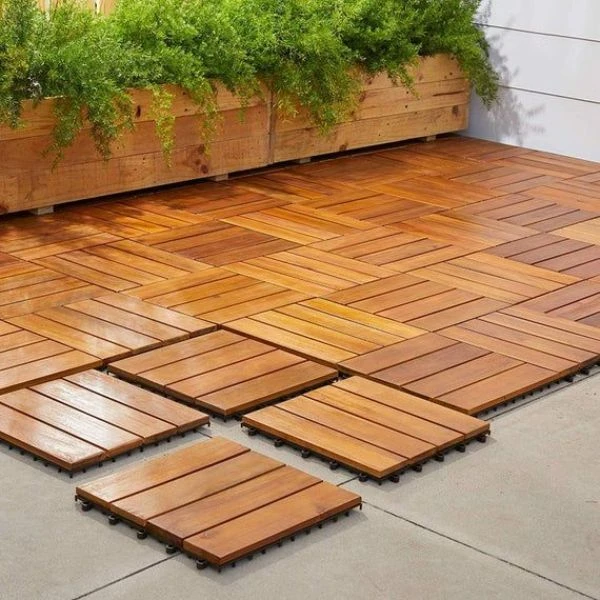 Interlocking wood deck tiles on concrete floor