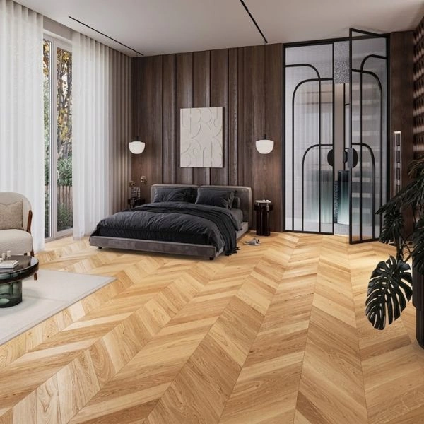 Modern bedroom with light chevron parquet flooring