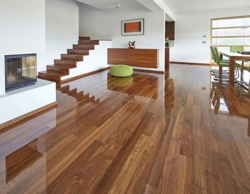 Premium glossy walnut laminate flooring in Dubai