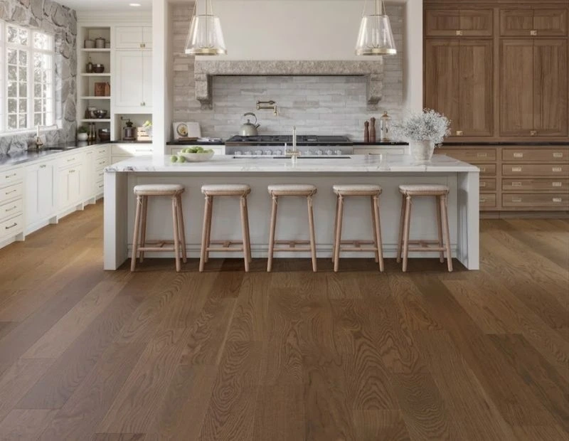 Luxury kitchen island with oak flooring