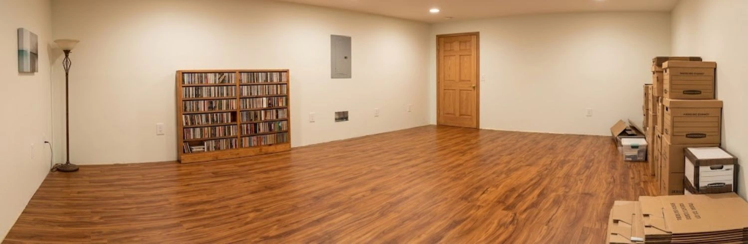 Large storage room warm teak vinyl flooring