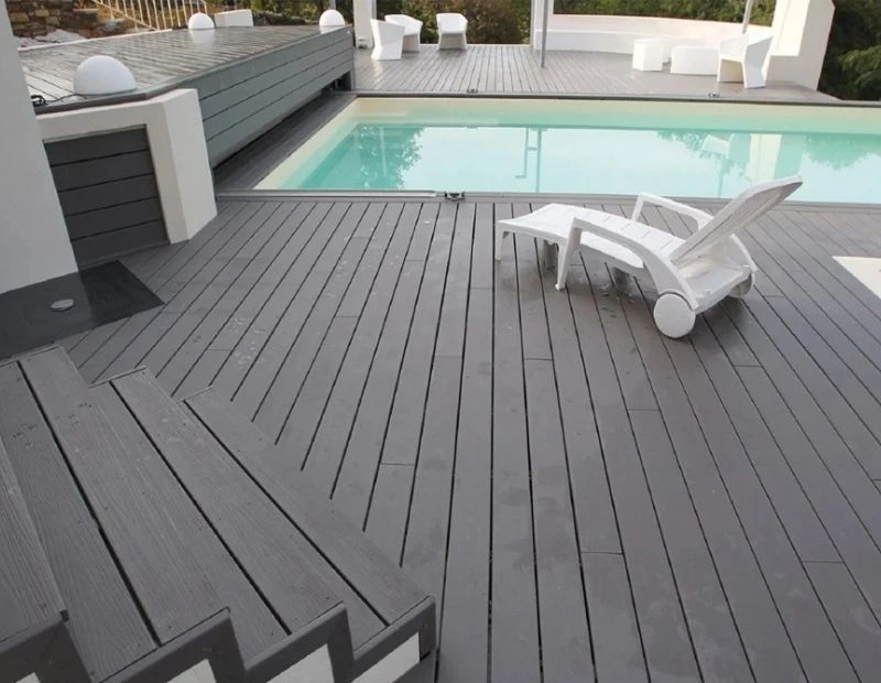 Swimming pool deck with grey WPC flooring