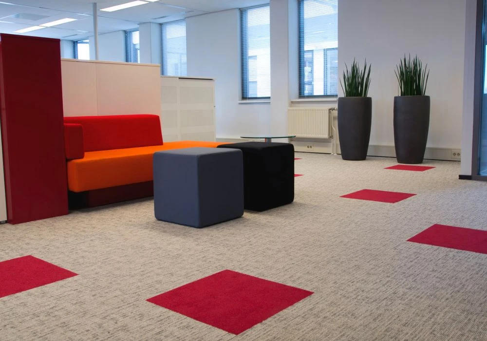 Beige carpet with red accent squares in Dubai office
