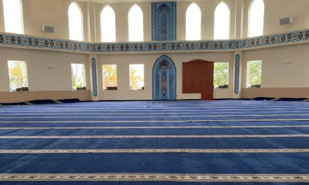 Blue mosque carpet with prayer rows in UAE