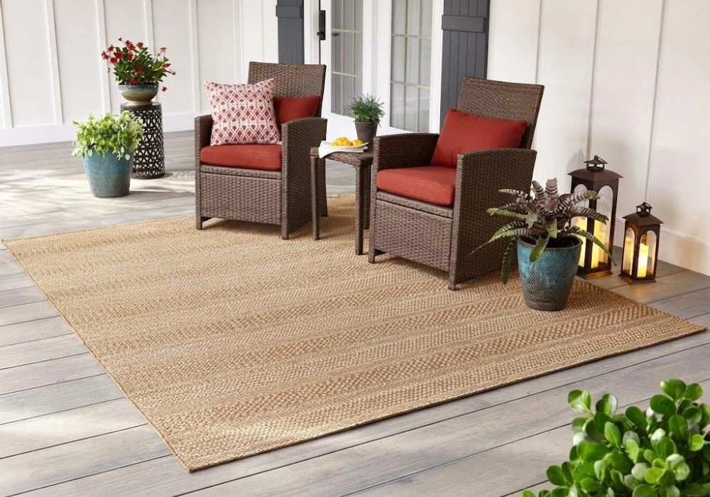 Brown wicker outdoor chairs on carpet