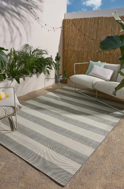 Grey striped outdoor carpet patio setup